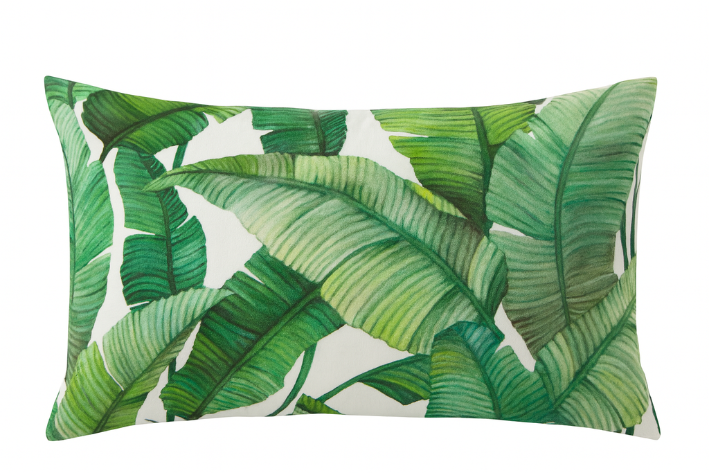 Pillow with green leaf pattern on a white background
